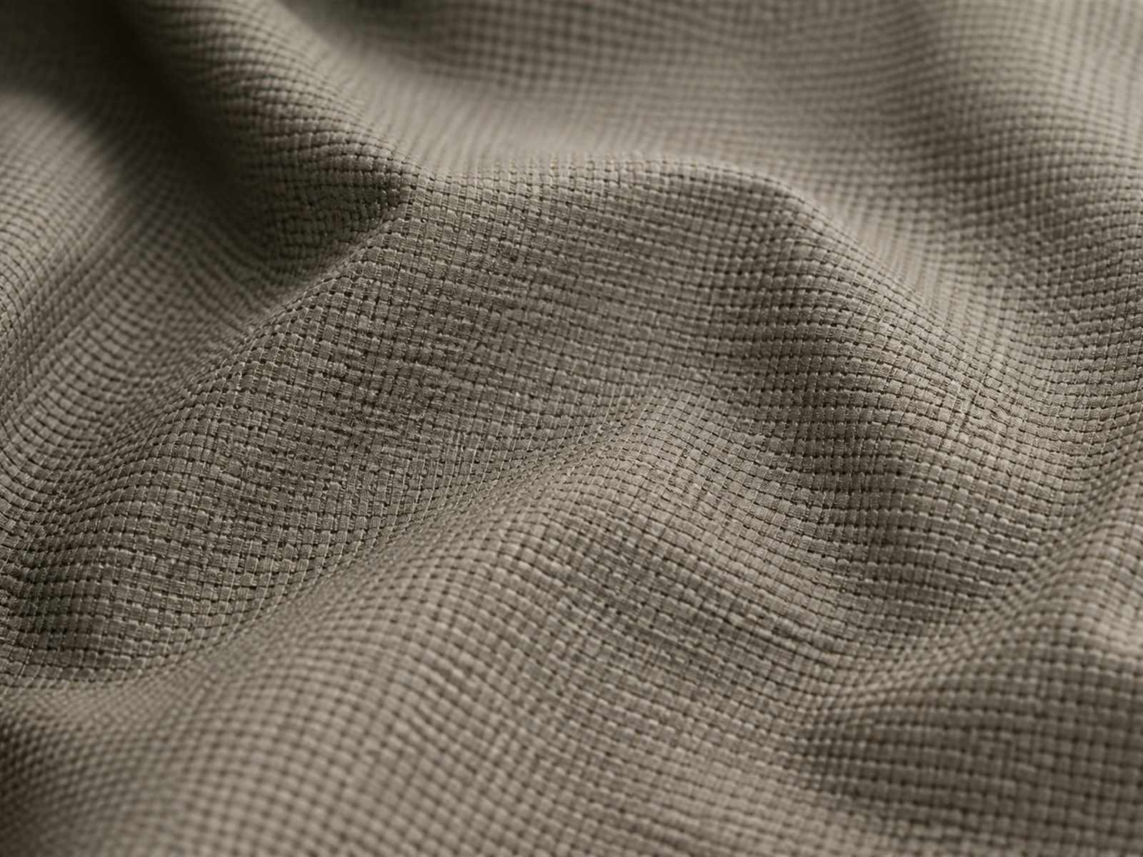 Macro view of mechanical stretch fabric showing textured yarn structure used in tactical clothing