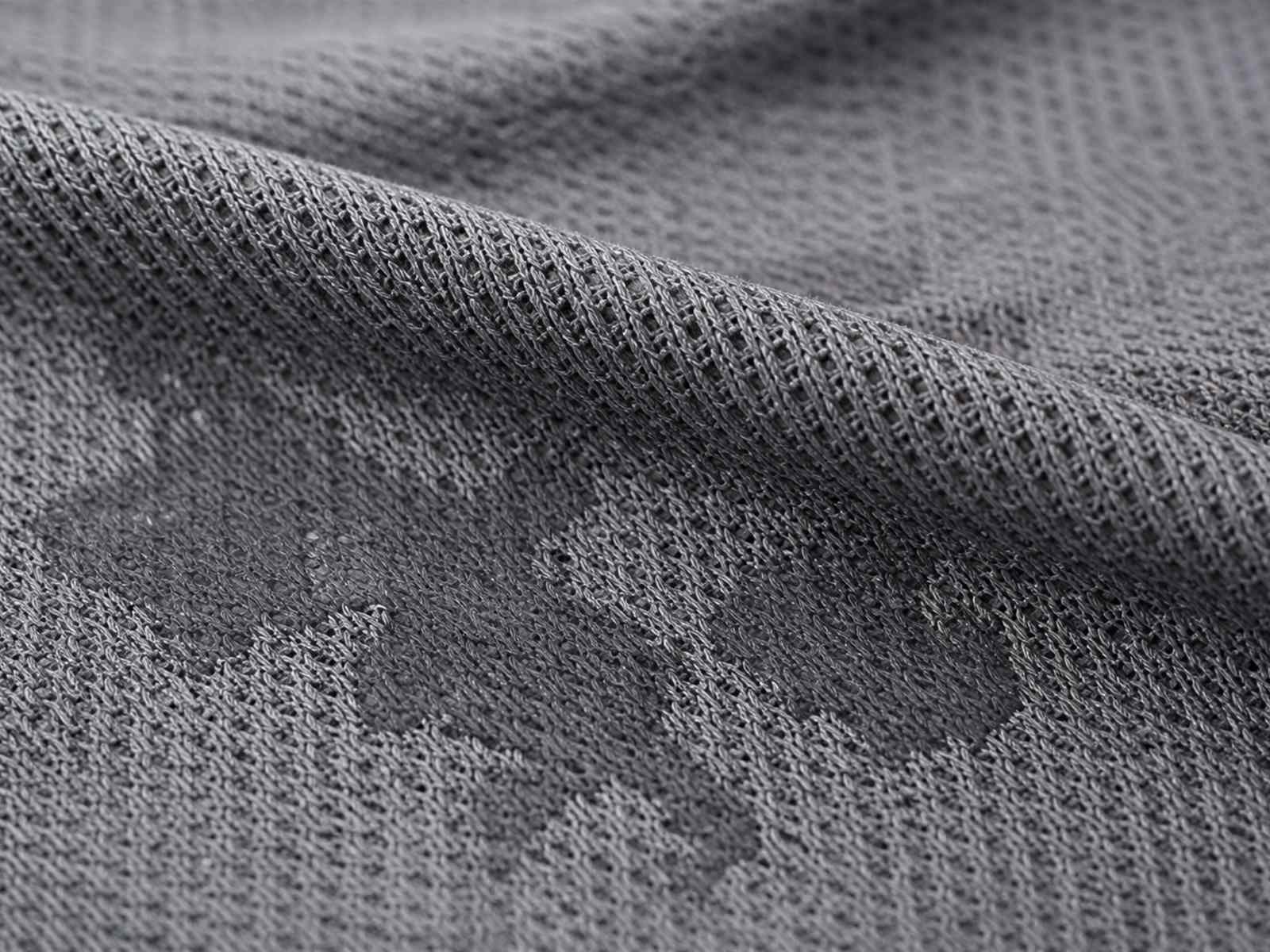 Macro view of moisture wicking fabric showing inner and outer surface structure for tactical base layers
