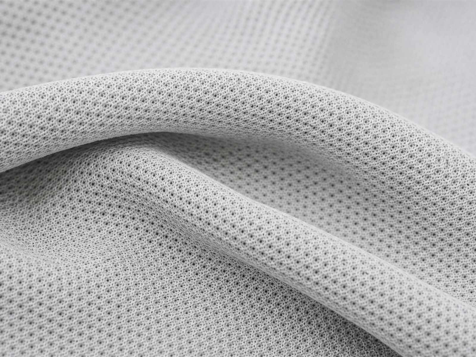 Macro view of quick dry fabric showing open structure and synthetic filament yarns for hot weather tactical clothing