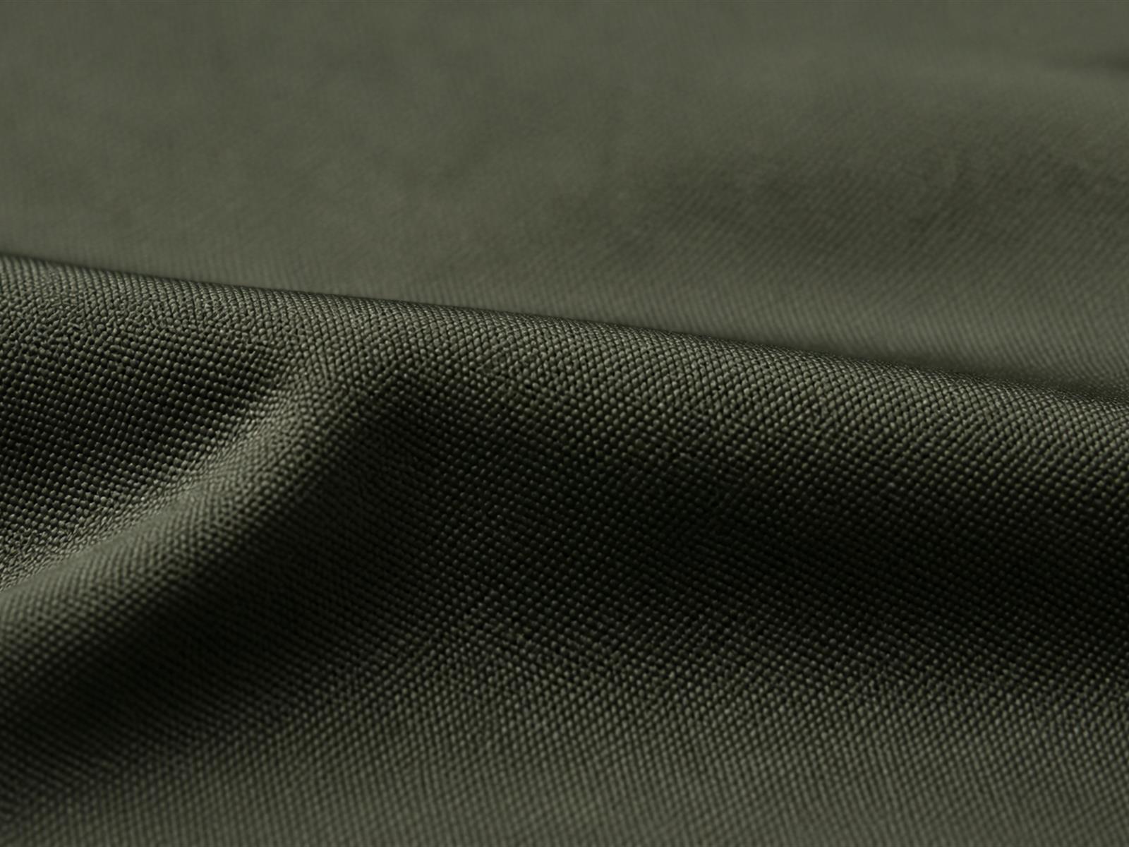 Macro view of wind resistant fabric showing dense weave structure used in tactical field jackets